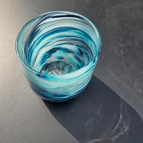 Glass with blue and white swirls